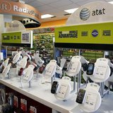 AT&T mobile phones are seen for sale alongside T-Mobile phones at a RadioShack electronics store in Los Angeles August 31, 2011. REUTERS/Dan AT&T mobile phones are seen for sale alongside T-Mobile phones at a RadioShack electronics store in Los Angeles August 31, 2011. REUTERS/Dan