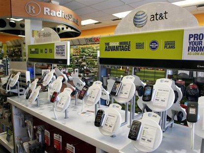 AT&T mobile phones are seen for sale alongside T-Mobile phones at a RadioShack electronics store in Los Angeles August 31, 2011. REUTERS/Dan AT&T mobile phones are seen for sale alongside T-Mobile phones at a RadioShack electronics store in Los Angeles August 31, 2011. REUTERS/Dan