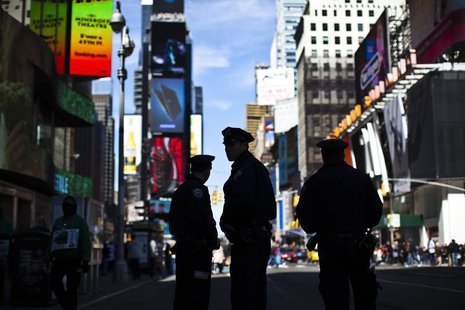 New York Police officers keep watch on tourists at Times Square in New York April 21, 2013. REUTERS/Eduardo Munoz New York Police officers keep watch on tourists at Times Square in New York April 21, 2013. REUTERS/Eduardo Munoz