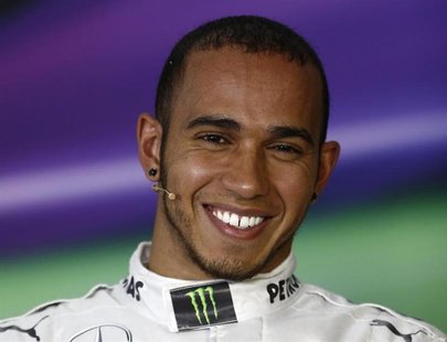 Mercedes Formula One driver Lewis Hamilton of Britain smiles at a press conference after the qualifying session for the Chinese F1 Grand Pri Mercedes Formula One driver Lewis Hamilton of Britain smiles at a press conference after the qualifying session for the Chinese F1 Grand Pri