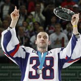 Slovakia's Zdeno Chara wears jersey with the number of the former Slovak national team captain Pavol Demitra as he holds a trophy after thei Slovakia's Zdeno Chara wears jersey with the number of the former Slovak national team captain Pavol Demitra as he holds a trophy after thei