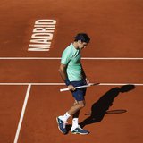 Roger Federer of Switzerland reacts after losing a point to Kei Nishikori of Japan during their men's singles match at the Madrid Open tenni Roger Federer of Switzerland reacts after losing a point to Kei Nishikori of Japan during their men's singles match at the Madrid Open tenni