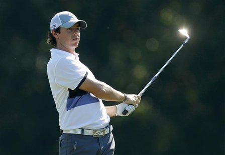 Rory McIlroy of Northern Ireland watches his approach shot on the 14th hole during the first round of The Players Championship PGA golf tour Rory McIlroy of Northern Ireland watches his approach shot on the 14th hole during the first round of The Players Championship PGA golf tour