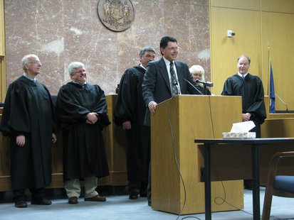 Sheriff Scott Parks addresses crowd surrounded by Marathon County Judges.
Sheriff Scott Parks addresses crowd surrounded by Marathon County Judges.