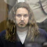Tim Lambesis, lead singer for the heavy metal band As I Lay Dying, looks on during his arraignment in San Diego North County court in Vista,