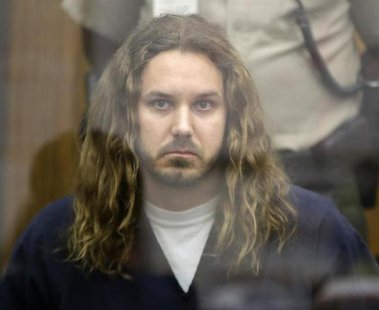 Tim Lambesis, lead singer for the heavy metal band As I Lay Dying, looks on during his arraignment in San Diego North County court in Vista, Tim Lambesis, lead singer for the heavy metal band As I Lay Dying, looks on during his arraignment in San Diego North County court in Vista,
