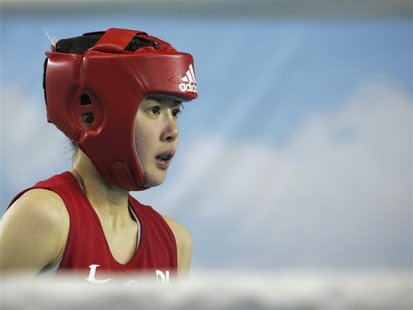 Lee Si-young (R) prepares for her match in the 48 kg (106 lb) class at the South Korean national team tryouts in Chungju, southeast of Seoul Lee Si-young (R) prepares for her match in the 48 kg (106 lb) class at the South Korean national team tryouts in Chungju, southeast of Seoul