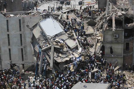 People rescue garment workers trapped under rubble at the Rana Plaza building after it collapsed, in Savar, 30 km (19 miles) outside Dhaka i People rescue garment workers trapped under rubble at the Rana Plaza building after it collapsed, in Savar, 30 km (19 miles) outside Dhaka i