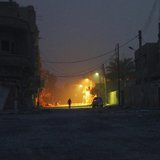 A man walks along a deserted street in Deir al-Zor April 8, 2013. REUTERS/ Khalil Ashawi