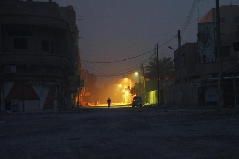 A man walks along a deserted street in Deir al-Zor April 8, 2013. REUTERS/ Khalil Ashawi A man walks along a deserted street in Deir al-Zor April 8, 2013. REUTERS/ Khalil Ashawi
