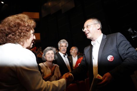 Bulgarian Socialist Party (BSP) leader Sergei Stanishev shakes hands with a supporter during an election rally at the National Palace of Cul Bulgarian Socialist Party (BSP) leader Sergei Stanishev shakes hands with a supporter during an election rally at the National Palace of Cul