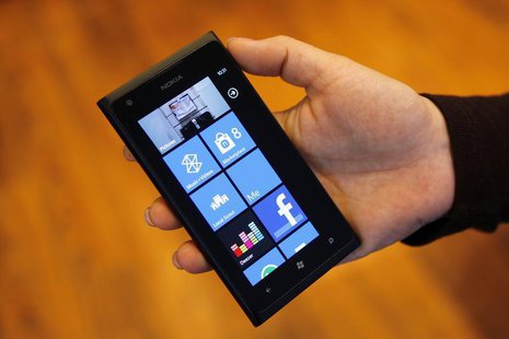 A woman holds a Nokia smartphone in this photo illustration taken in Bucharest January 24, 2013. REUTERS/Bogdan Cristel A woman holds a Nokia smartphone in this photo illustration taken in Bucharest January 24, 2013. REUTERS/Bogdan Cristel