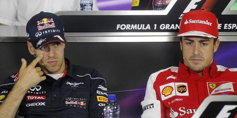 Ferrari Formula One driver Fernando Alonso (R) of Spain and Red Bull driver Sebastian Vettel of Germany attend a news conference ahead of th Ferrari Formula One driver Fernando Alonso (R) of Spain and Red Bull driver Sebastian Vettel of Germany attend a news conference ahead of th