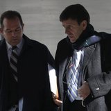 Spanish doctor Eufemiano Fuentes (R) leaves a courthouse on the first day of the high-profile Operacion Puerto doping trial in Madrid, Janua
