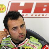 Ducati MotoGP rider Hector Barbera of Spain adjusts his earplugs inside his box during a training session at Circuit de Catalunya, in Montme