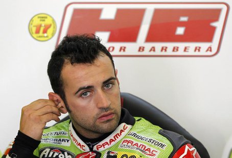 Ducati MotoGP rider Hector Barbera of Spain adjusts his earplugs inside his box during a training session at Circuit de Catalunya, in Montme Ducati MotoGP rider Hector Barbera of Spain adjusts his earplugs inside his box during a training session at Circuit de Catalunya, in Montme