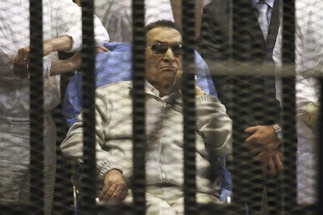 Egypt's ousted President Hosni Mubarak sits inside a dock at the police academy on the outskirts of Cairo April 15, 2013. REUTERS/Stringer Egypt's ousted President Hosni Mubarak sits inside a dock at the police academy on the outskirts of Cairo April 15, 2013. REUTERS/Stringer