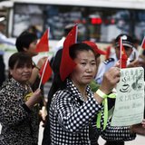 People participate in a protest against a battery factory on a street of Songjiang district, on the outskirts of Shanghai May 11, 2013. REUT People participate in a protest against a battery factory on a street of Songjiang district, on the outskirts of Shanghai May 11, 2013. REUT