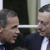 Bank of Canada Governor Mark Carney (L) speaks to the President of the European Central Bank Mario Draghi as they pose for a group photograp