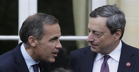 Bank of Canada Governor Mark Carney (L) speaks to the President of the European Central Bank Mario Draghi as they pose for a group photograp Bank of Canada Governor Mark Carney (L) speaks to the President of the European Central Bank Mario Draghi as they pose for a group photograp