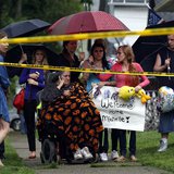Deborah Knight (C), grandmother of Michelle Knight, talks on the phone outside of kidnap victim Gina DeJesus' home in Cleveland, Ohio, May 1 Deborah Knight (C), grandmother of Michelle Knight, talks on the phone outside of kidnap victim Gina DeJesus' home in Cleveland, Ohio, May 1