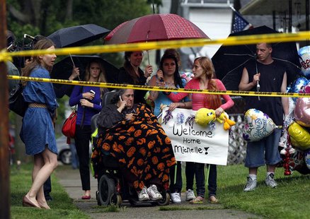 Deborah Knight (C), grandmother of Michelle Knight, talks on the phone outside of kidnap victim Gina DeJesus' home in Cleveland, Ohio, May 1 Deborah Knight (C), grandmother of Michelle Knight, talks on the phone outside of kidnap victim Gina DeJesus' home in Cleveland, Ohio, May 1