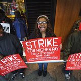 Demonstrators protesting low wages and the lack of union representation in the fast food industry chant and hold signs outside of a McDonald's restaurant near Times Square in New York, April 4, 2013. 
REUTERS/Lucas Jackson