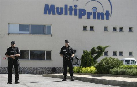 Bulgarian police stand guard outside a printing house in the town of Kostinbrod, near Sofia May 11, 2013. REUTERS/Lyubomir Spirov/BGNES Bulgarian police stand guard outside a printing house in the town of Kostinbrod, near Sofia May 11, 2013. REUTERS/Lyubomir Spirov/BGNES