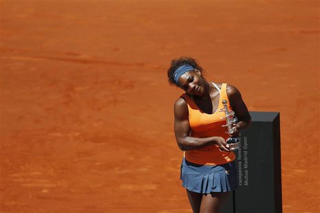 Serena Williams of the U.S. poses with the Ion Tiriac's trophy after winning the Madrid Open final tennis match against Maria Sharapova of R Serena Williams of the U.S. poses with the Ion Tiriac's trophy after winning the Madrid Open final tennis match against Maria Sharapova of R