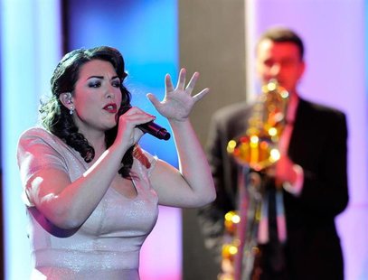 Dutch singer Caro Emerald performs after being awarded in category "Best International Music Artist" during the 47th Golden Camera award cer Dutch singer Caro Emerald performs after being awarded in category "Best International Music Artist" during the 47th Golden Camera award cer