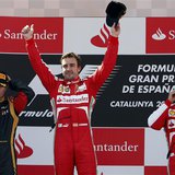 Winner Ferrari Formula One driver Fernando Alonso of Spain (C) celebrates as second-place Lotus Formula One driver Kimi Raikkonen of Finland Winner Ferrari Formula One driver Fernando Alonso of Spain (C) celebrates as second-place Lotus Formula One driver Kimi Raikkonen of Finland
