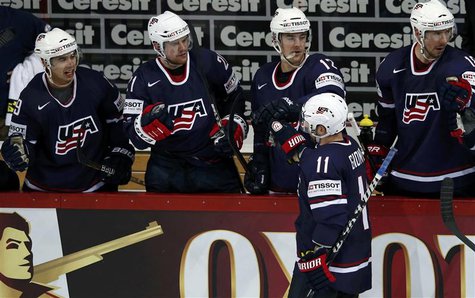 Team USA's Stephen Gionta (11) celebrates his goal against Germany with his teammates on the bench during their 2013 IIHF Ice Hockey World C Team USA's Stephen Gionta (11) celebrates his goal against Germany with his teammates on the bench during their 2013 IIHF Ice Hockey World C