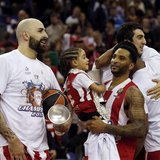 Olympiakos' Pero Antic (L) and Acie Law with a child celebrate victory over Real Madrid after their Euroleague Basketball Final Four final g Olympiakos' Pero Antic (L) and Acie Law with a child celebrate victory over Real Madrid after their Euroleague Basketball Final Four final g