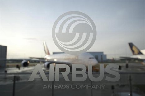 An A380 aircraft is seen through a window with an Airbus logo during the EADS / Airbus 'New Year Press Conference' in Hamburg January 17, 20 An A380 aircraft is seen through a window with an Airbus logo during the EADS / Airbus 'New Year Press Conference' in Hamburg January 17, 20