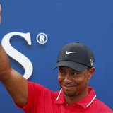 Tiger Woods reacts after being presented with The Players Championship trophy after winning the PGA golf tournament at TPC Sawgrass in Ponte Tiger Woods reacts after being presented with The Players Championship trophy after winning the PGA golf tournament at TPC Sawgrass in Ponte