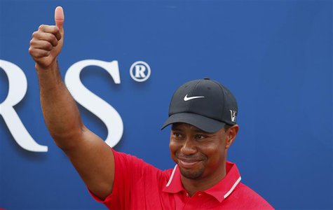 Tiger Woods reacts after being presented with The Players Championship trophy after winning the PGA golf tournament at TPC Sawgrass in Ponte Tiger Woods reacts after being presented with The Players Championship trophy after winning the PGA golf tournament at TPC Sawgrass in Ponte