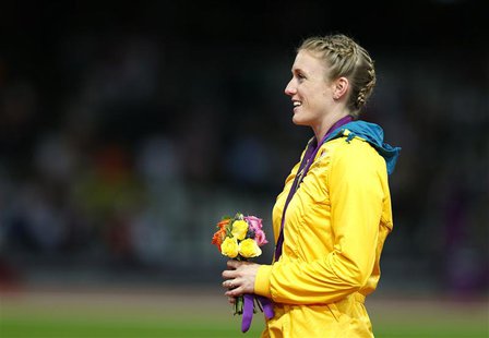 Australia's Sally Pearson stands on the podium after being presented with the gold medal for the women's 100m hurdles at the London 2012 Oly Australia's Sally Pearson stands on the podium after being presented with the gold medal for the women's 100m hurdles at the London 2012 Oly