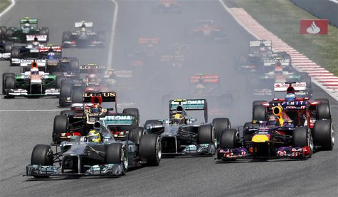 Mercedes Formula One driver Nico Rosberg of Germany (bottom L) leads going into the first curve in the first lap during the Spanish F1 Grand Mercedes Formula One driver Nico Rosberg of Germany (bottom L) leads going into the first curve in the first lap during the Spanish F1 Grand