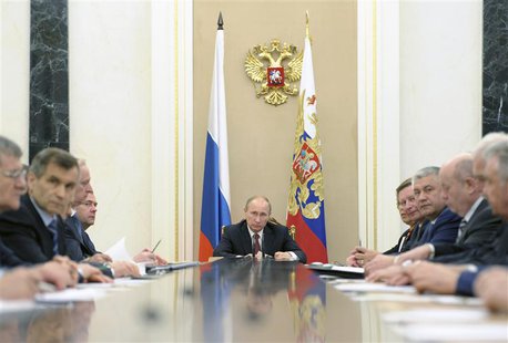 Russian President Vladimir Putin (C) attends a meeting of the Security Council in Moscow's Kremlin May 8, 2013. Picture taken May 8, 2013. R Russian President Vladimir Putin (C) attends a meeting of the Security Council in Moscow's Kremlin May 8, 2013. Picture taken May 8, 2013. R
