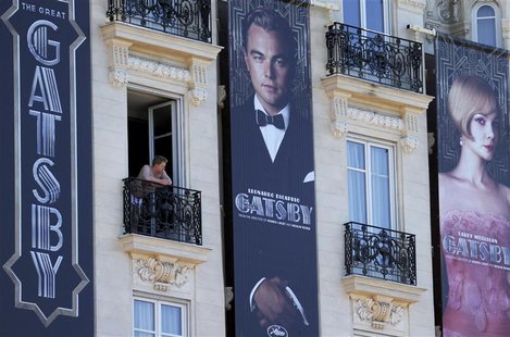 Posters for the film 'The Great Gatsby' showing actor Leonardo DiCaprio (C) and actress Carey Mulligan (R) are displayed outside the Carlton Posters for the film 'The Great Gatsby' showing actor Leonardo DiCaprio (C) and actress Carey Mulligan (R) are displayed outside the Carlton