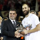 Olympiakos' Vassilis Spanoulis (R) receives the MVP trophy after their Euroleague Basketball Final Four final game against Real Madird at th Olympiakos' Vassilis Spanoulis (R) receives the MVP trophy after their Euroleague Basketball Final Four final game against Real Madird at th