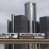 Two cars of the 'people mover' public rail are seen covered with a advertisement for the 2014 Chevy Silverado pickup truck as they move past Two cars of the 'people mover' public rail are seen covered with a advertisement for the 2014 Chevy Silverado pickup truck as they move past