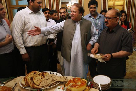 Nawaz Sharif (C), the leader of Pakistan Muslim League - Nawaz (PML-N), invites foreign reporters for a lunch at his residence in Lahore May Nawaz Sharif (C), the leader of Pakistan Muslim League - Nawaz (PML-N), invites foreign reporters for a lunch at his residence in Lahore May