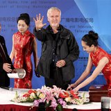 Canadian film director James Cameron shows his palm after making a handprint following a seminar on 3D technology and film cooperation durin Canadian film director James Cameron shows his palm after making a handprint following a seminar on 3D technology and film cooperation durin