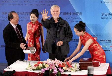 Canadian film director James Cameron shows his palm after making a handprint following a seminar on 3D technology and film cooperation durin Canadian film director James Cameron shows his palm after making a handprint following a seminar on 3D technology and film cooperation durin