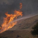 Fire-fighters battle walls of flames to protect homes during the second day of the Springs Fire in the mountain areas of Ventura County, Cal Fire-fighters battle walls of flames to protect homes during the second day of the Springs Fire in the mountain areas of Ventura County, Cal