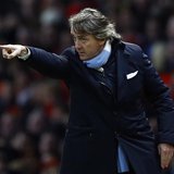 Manchester City's coach Roberto Mancini gestures during their English Premier League soccer match against Manchester United in Manchester, n Manchester City's coach Roberto Mancini gestures during their English Premier League soccer match against Manchester United in Manchester, n