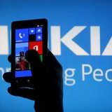 A woman poses with a Nokia Lumia smartphone in this photo illustration in the central Bosnian town of Zenica, May 6, 2013. REUTERS/Dado Ruvi A woman poses with a Nokia Lumia smartphone in this photo illustration in the central Bosnian town of Zenica, May 6, 2013. REUTERS/Dado Ruvi