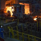 A worker stands in front of a rolling mill in the ArcelorMittal steel factory in Eisenhuettenstadt, 124 km (77 miles) east of Berlin Novembe A worker stands in front of a rolling mill in the ArcelorMittal steel factory in Eisenhuettenstadt, 124 km (77 miles) east of Berlin Novembe