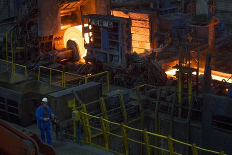 A worker stands in front of a rolling mill in the ArcelorMittal steel factory in Eisenhuettenstadt, 124 km (77 miles) east of Berlin Novembe A worker stands in front of a rolling mill in the ArcelorMittal steel factory in Eisenhuettenstadt, 124 km (77 miles) east of Berlin Novembe